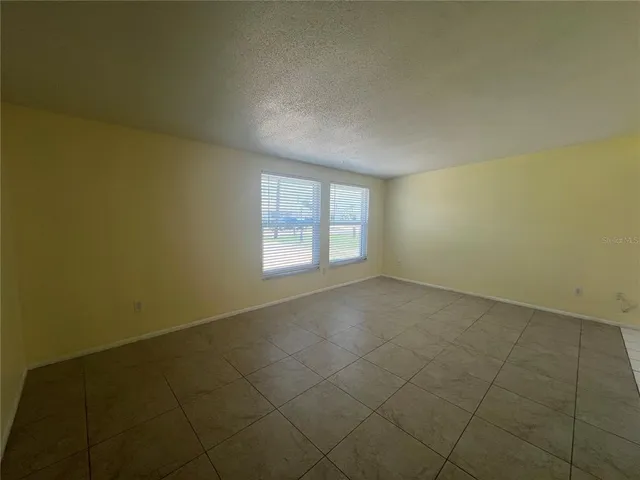 an empty room with a empty space and window