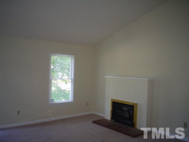 109 Bashford Road, Unit B Raleigh, NC 27606 - Photo 3 of 5 a room with a fireplace and a window