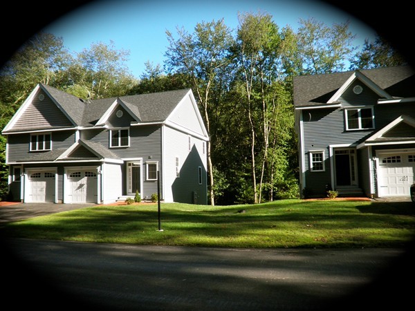 98 Dudley Road, Unit 98 Berlin, MA 01503 - Photo 2 of 14 a front view of a house with a yard