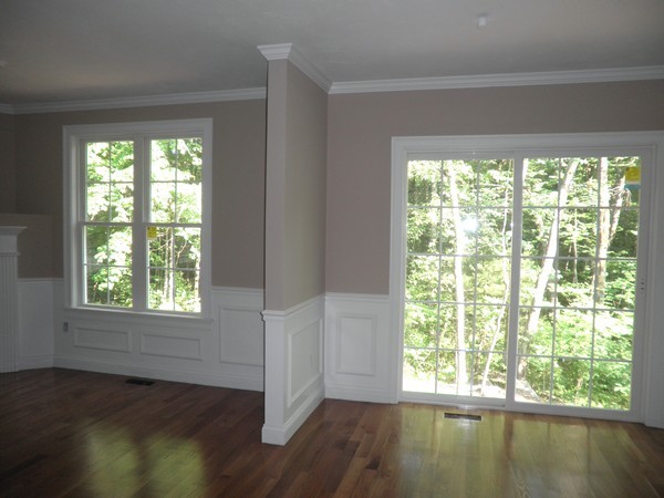 98 Dudley Road, Unit 98 Berlin, MA 01503 - Photo 6 of 14 a view of an empty room with wooden floor and a window