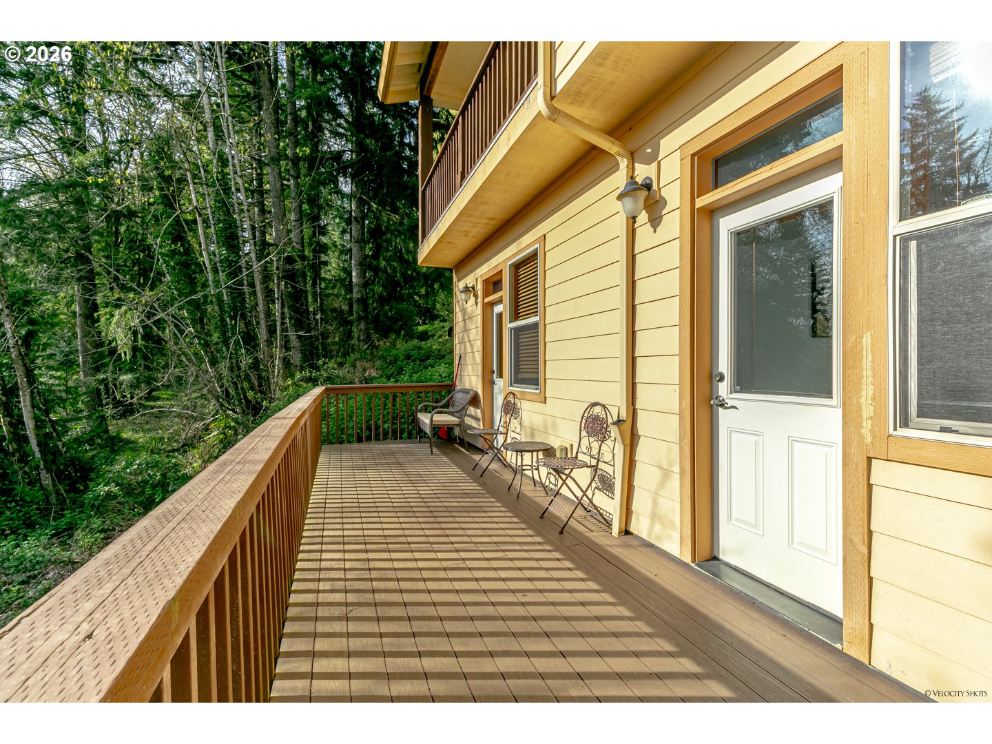 64636 Mc Intyre Road Rhododendron, OR 97049 - Photo 37 of 48 a view of balcony with wooden floor and fence