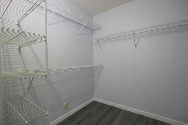 a front view of a house with swimming pool having outdoor seating