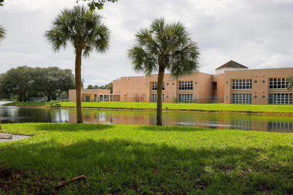 a view of a house with a wooden deck