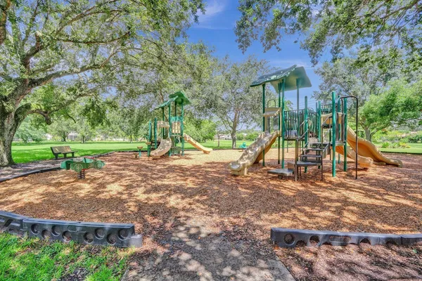 an outdoor space with furniture and garden