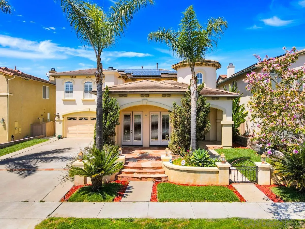 961 Red Granite Road Chula Vista, CA 91913 - Photo 1 of 27 a front view of a house with garden