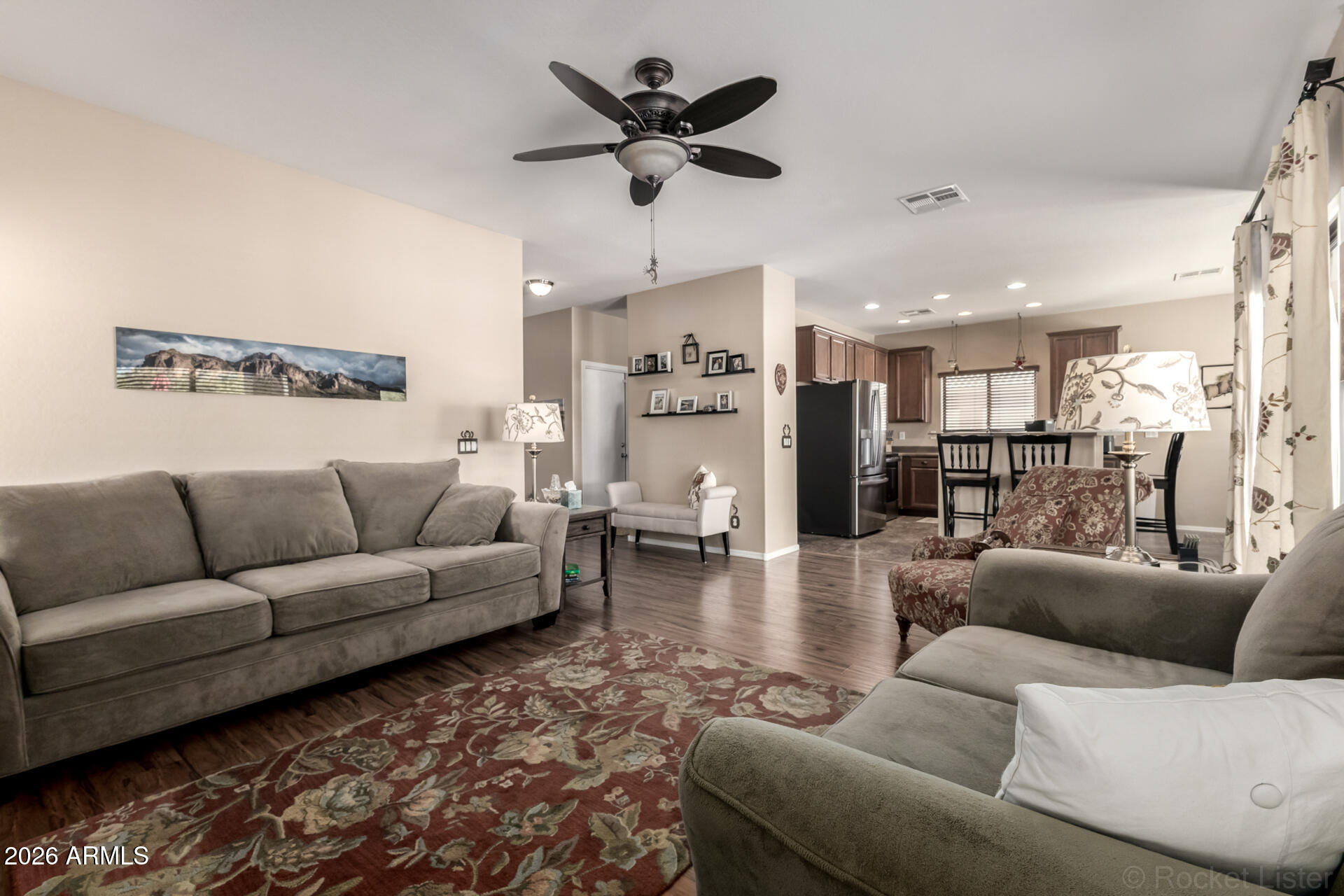 2756 South Powell Road Apache Junction, AZ 85119 - Photo 6 of 37 a living room with furniture and a view of kitchen