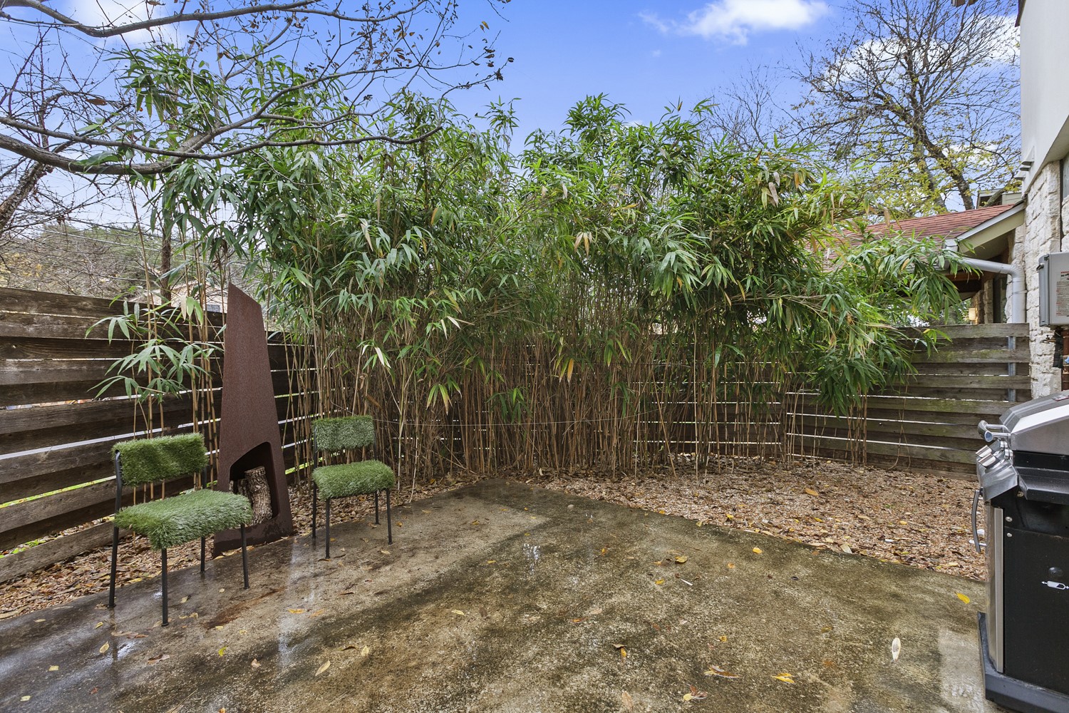805 Cumberland Road, Unit B Austin, TX 78704 - Photo 31 of 37 a backyard of a house with table and chairs