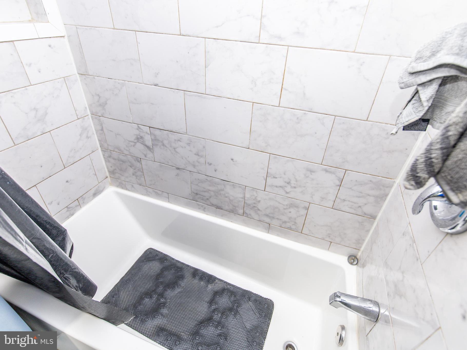 3934 Bel Pre Road, Unit 39342 Silver Spring, MD 20906 - Photo 15 of 30 a bathroom with a bathtub
