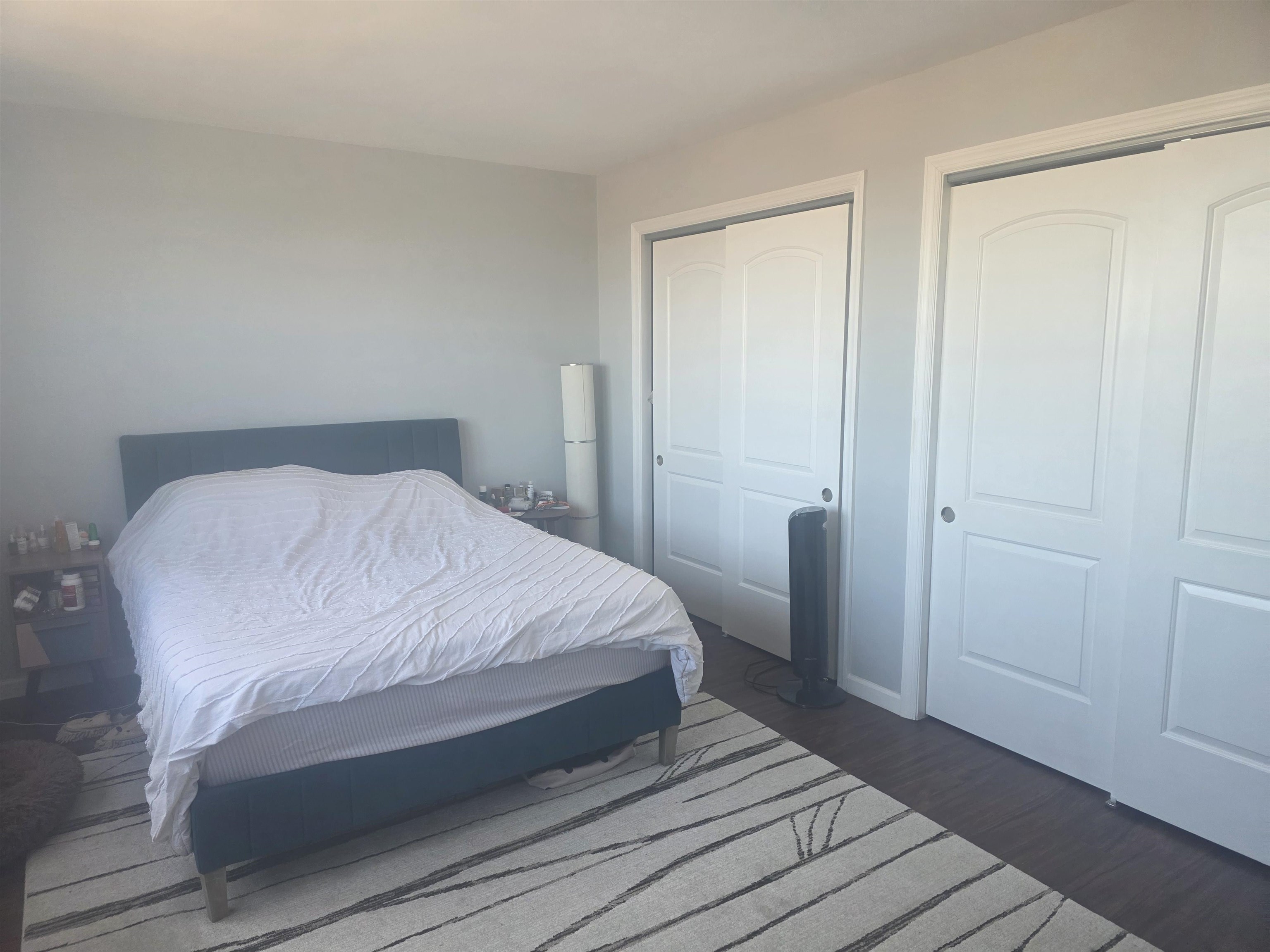 7100 Boulevard East, Unit 9R Guttenberg, NJ 07093 - Photo 13 of 19 a bedroom with a bed and a mirror