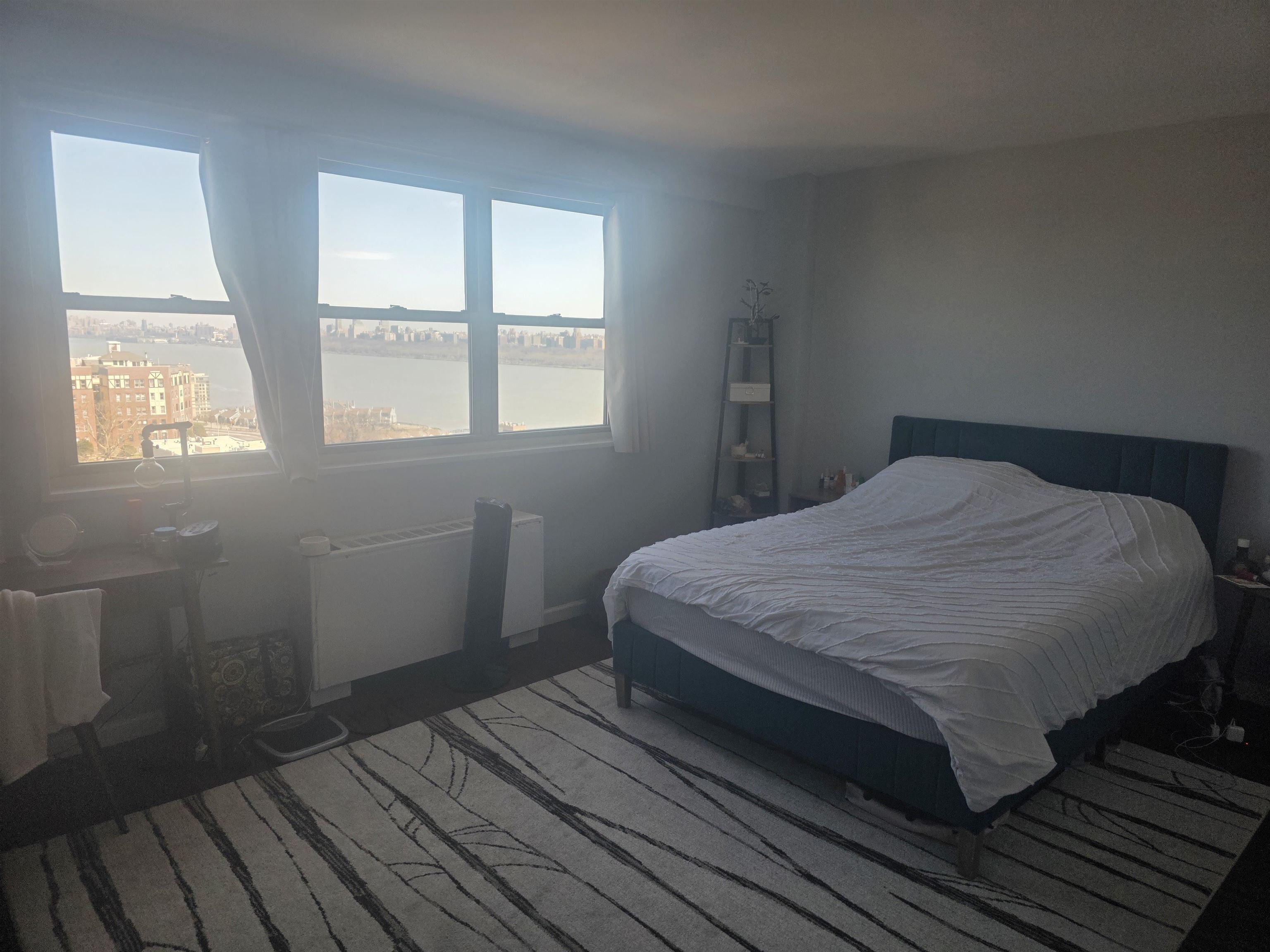 7100 Boulevard East, Unit 9R Guttenberg, NJ 07093 - Photo 14 of 19 a bedroom with a bed wooden floor and window