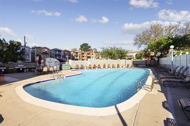 7100 Boulevard East, Unit 9R Guttenberg, NJ 07093 - Photo 15 of 19 a view of a swimming pool with outdoor seating