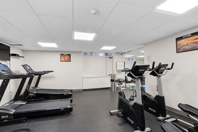 7100 Boulevard East, Unit 9R Guttenberg, NJ 07093 - Photo 18 of 19 a room with gym equipment and windows