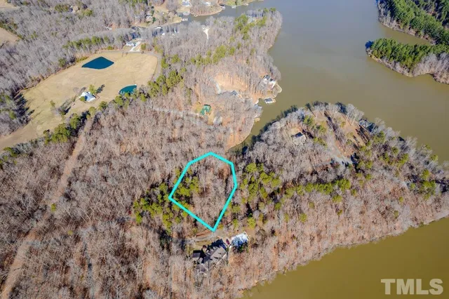 a view of a pond with a chair