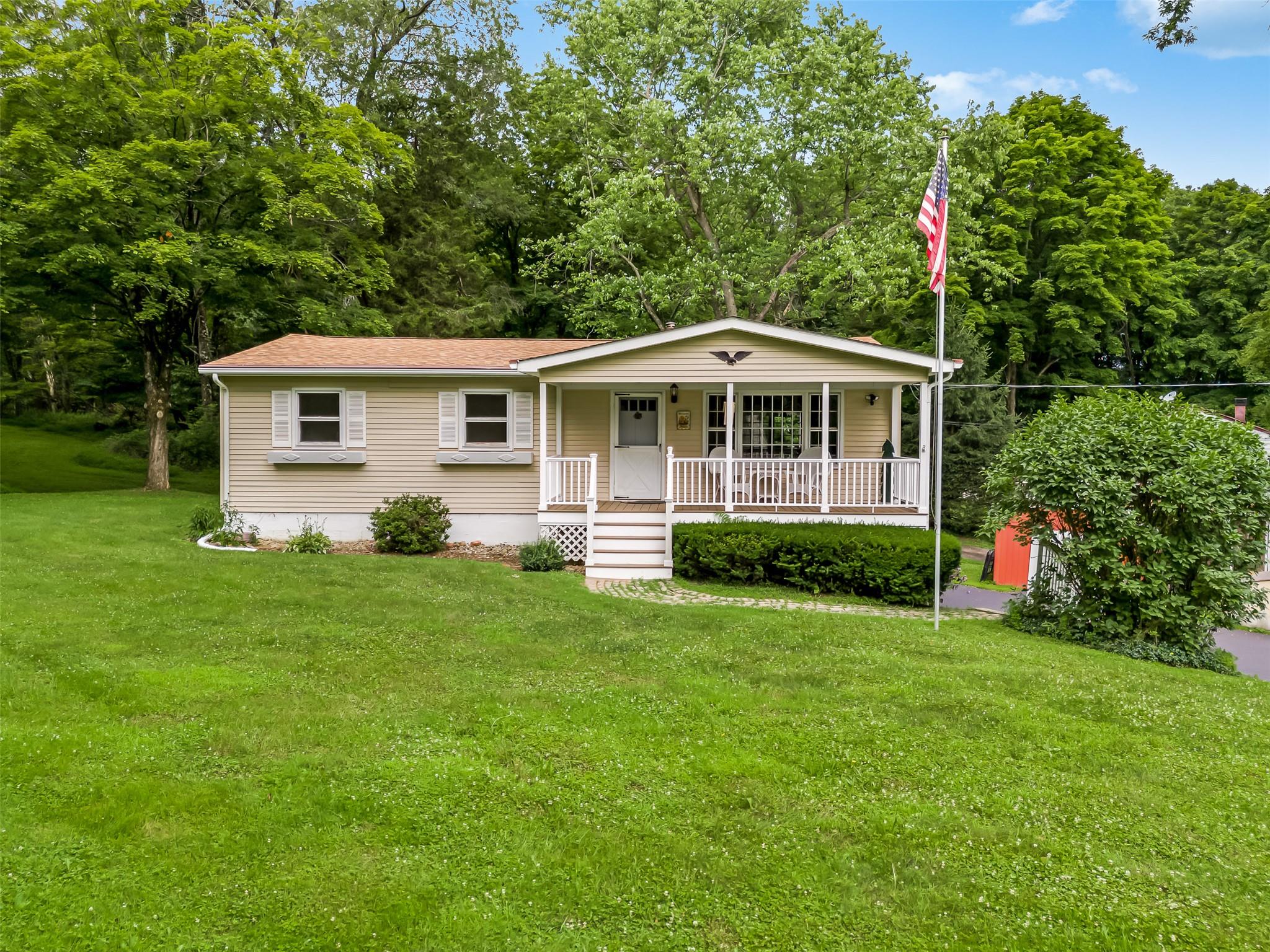 387 Freedom Road Pleasant Valley, NY 12569 - Photo 1 of 1 View of front of house featuring covered porch and a front lawn