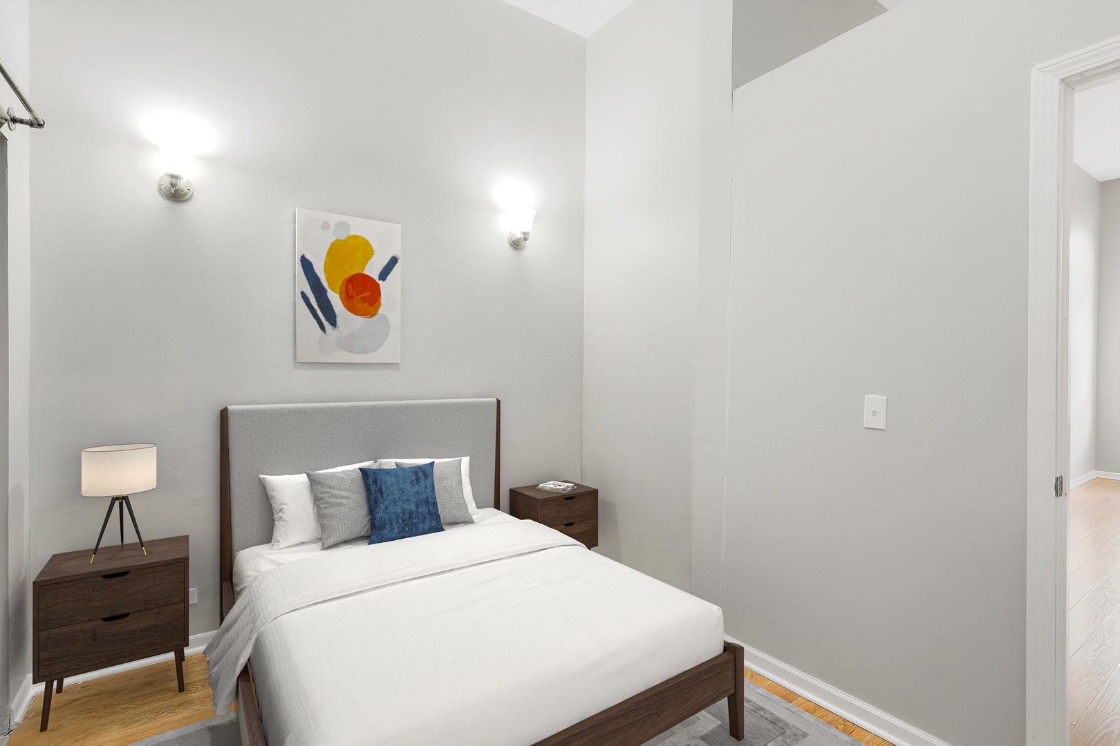 1726 North Sedgwick Street, Unit 1F Chicago, IL 60614 - Photo 6 of 8 a bedroom with a bed and painting on the wall