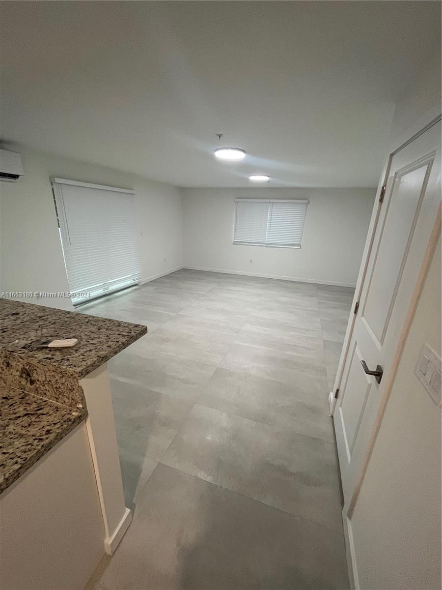 535 Southwest 5th Street, Unit 5 Miami, FL 33130 - Photo 6 of 19 a view of a kitchen cabinets and a stove top oven