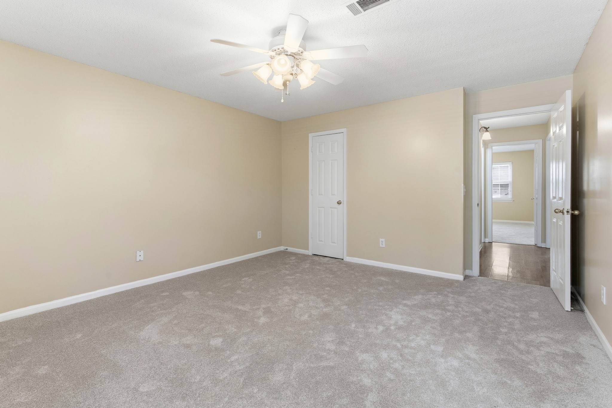 2009 Emery Lane Franklin, TN 37064 - Photo 18 of 39 an empty room with a chandelier fan and a bathroom