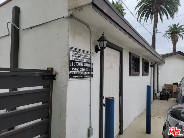 a view of a living room with furniture and wooden floor
