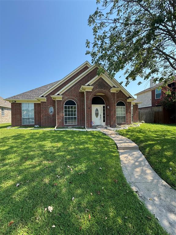 View of front of home with brick siding