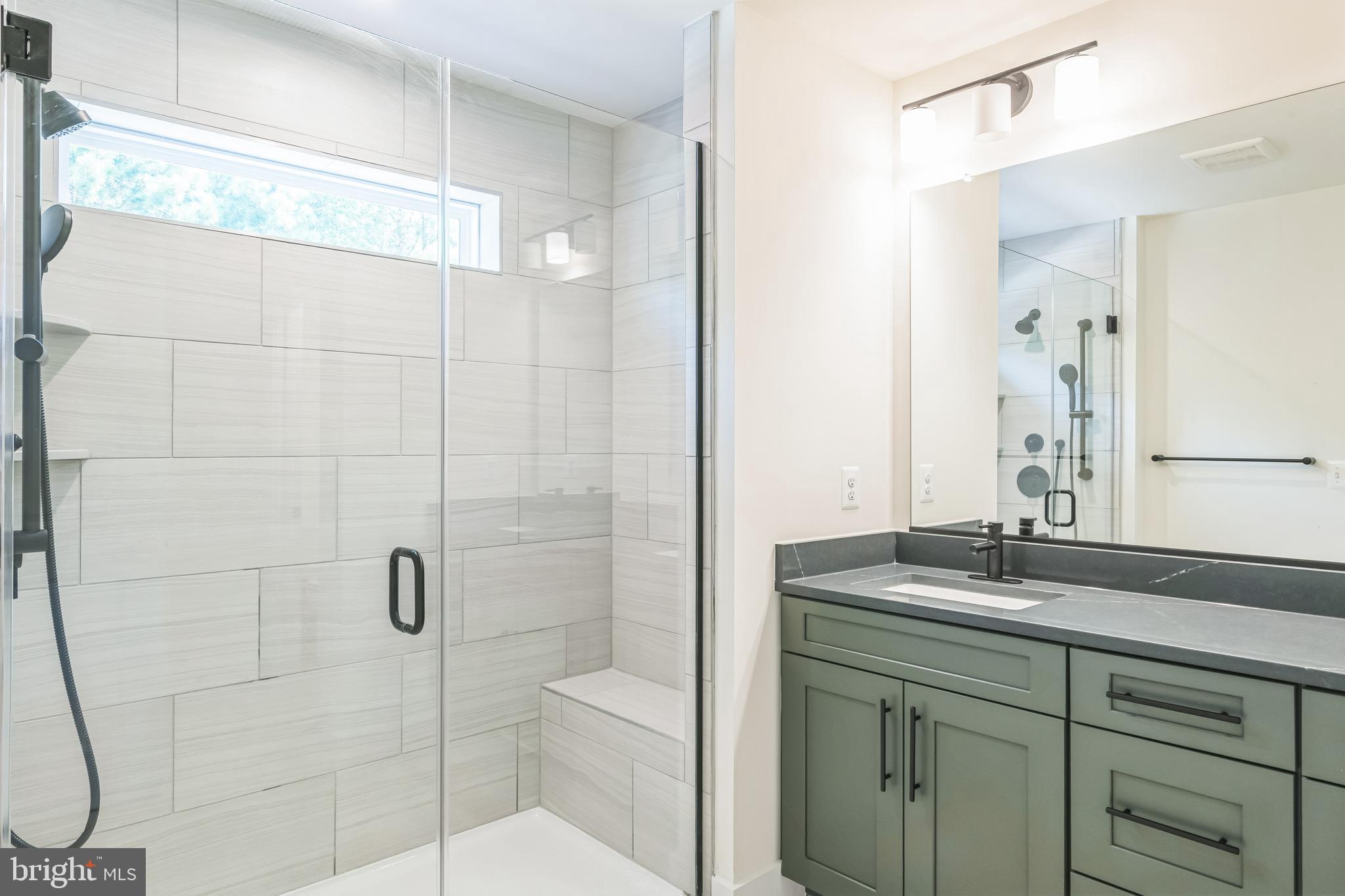 383 Scranton Lane Ocean View, DE 19970 - Photo 11 of 15 a bathroom with a sink shower and a mirror
