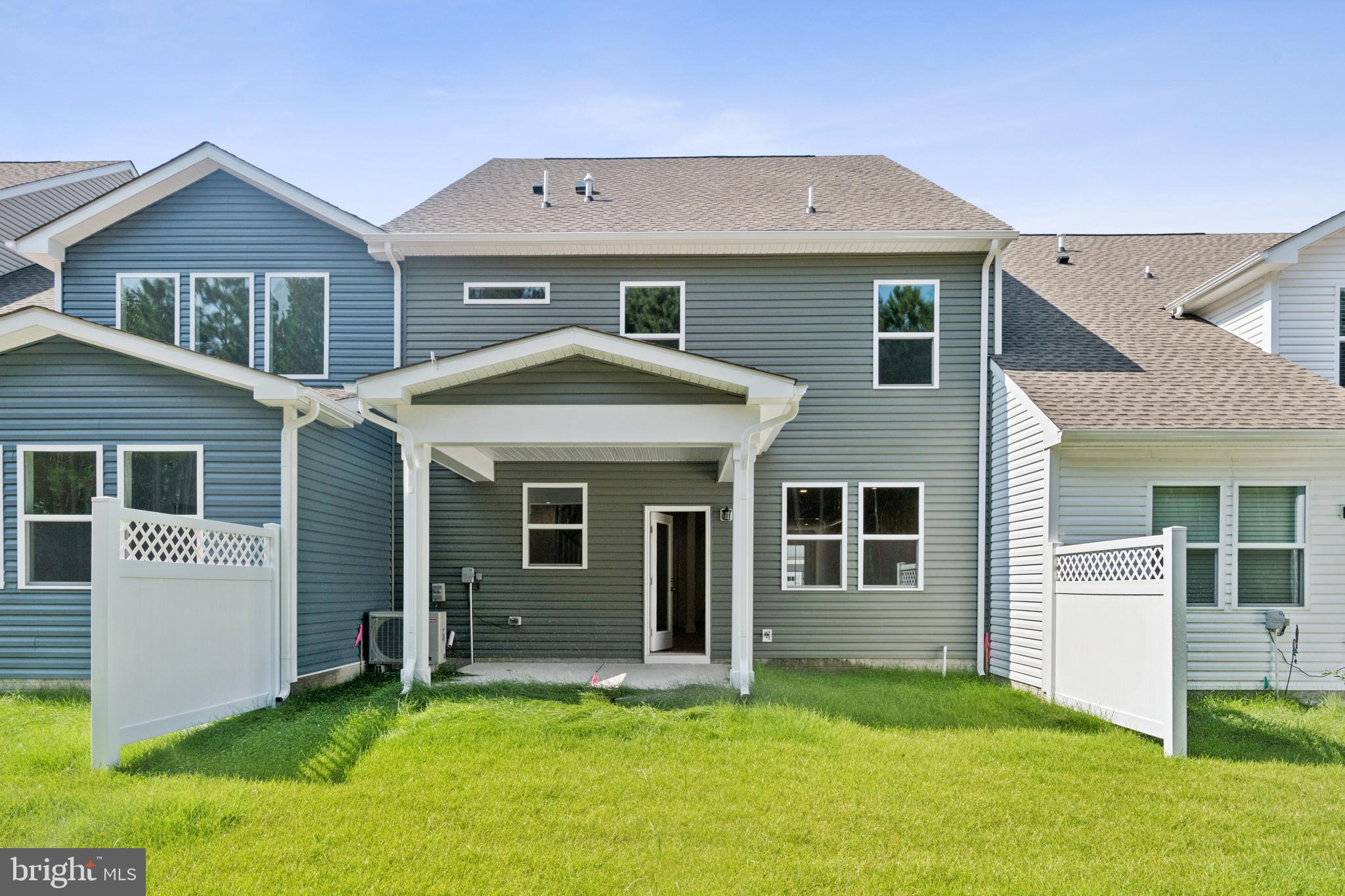 383 Scranton Lane Ocean View, DE 19970 - Photo 2 of 15 a front view of a house with a yard