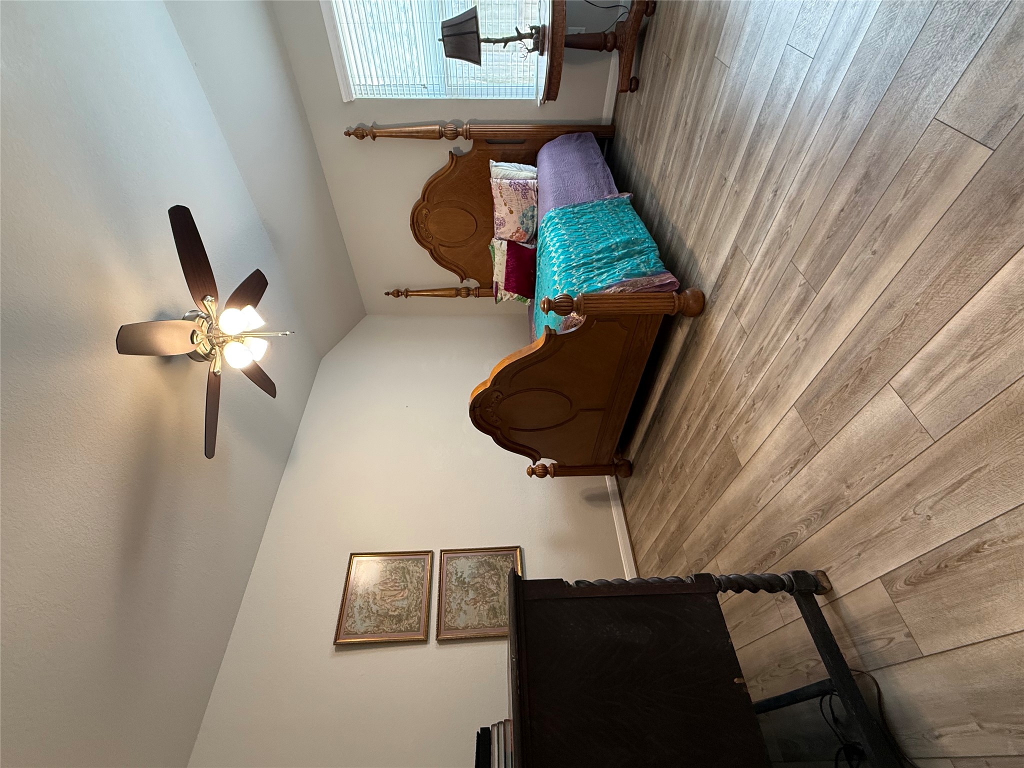 2336 Hagerman Road Conroe, TX 77384 - Photo 11 of 35 a spacious bedroom with a bed and a chandelier