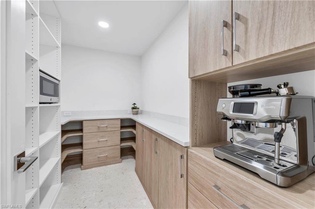 3777 Fountainhead Lane Naples, FL 34103 - Photo 14 of 18 a room with storage and utility