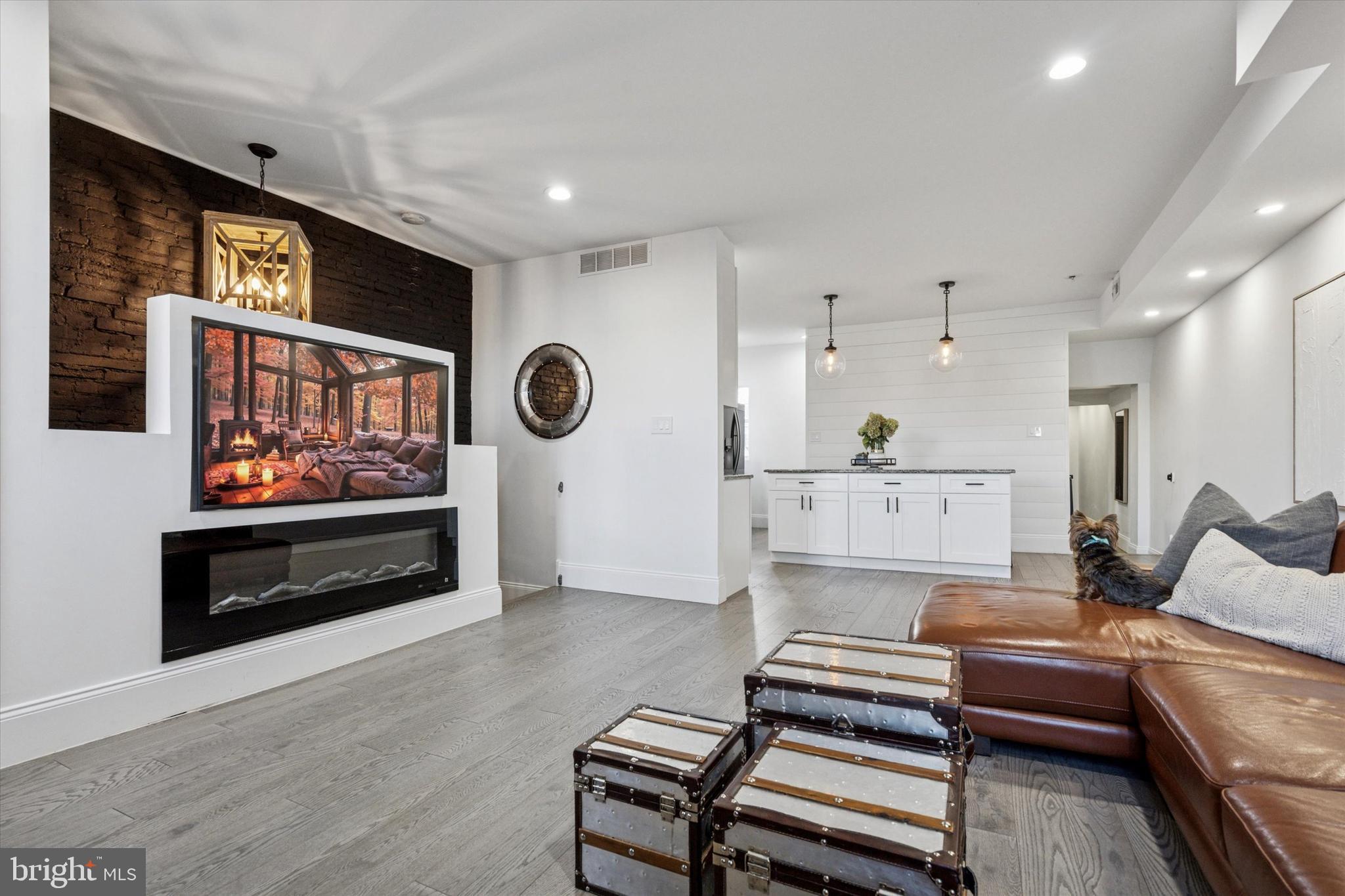 2694 Bridge Street Philadelphia, PA 19137 - Photo 6 of 41 a living room with furniture and a flat screen tv