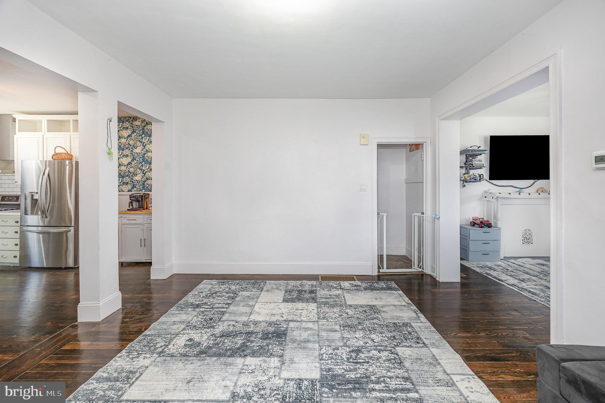 2527 South 3rd Street Steelton, PA 17113 - Photo 11 of 31 a view of a livingroom with wooden floor and a flat screen tv