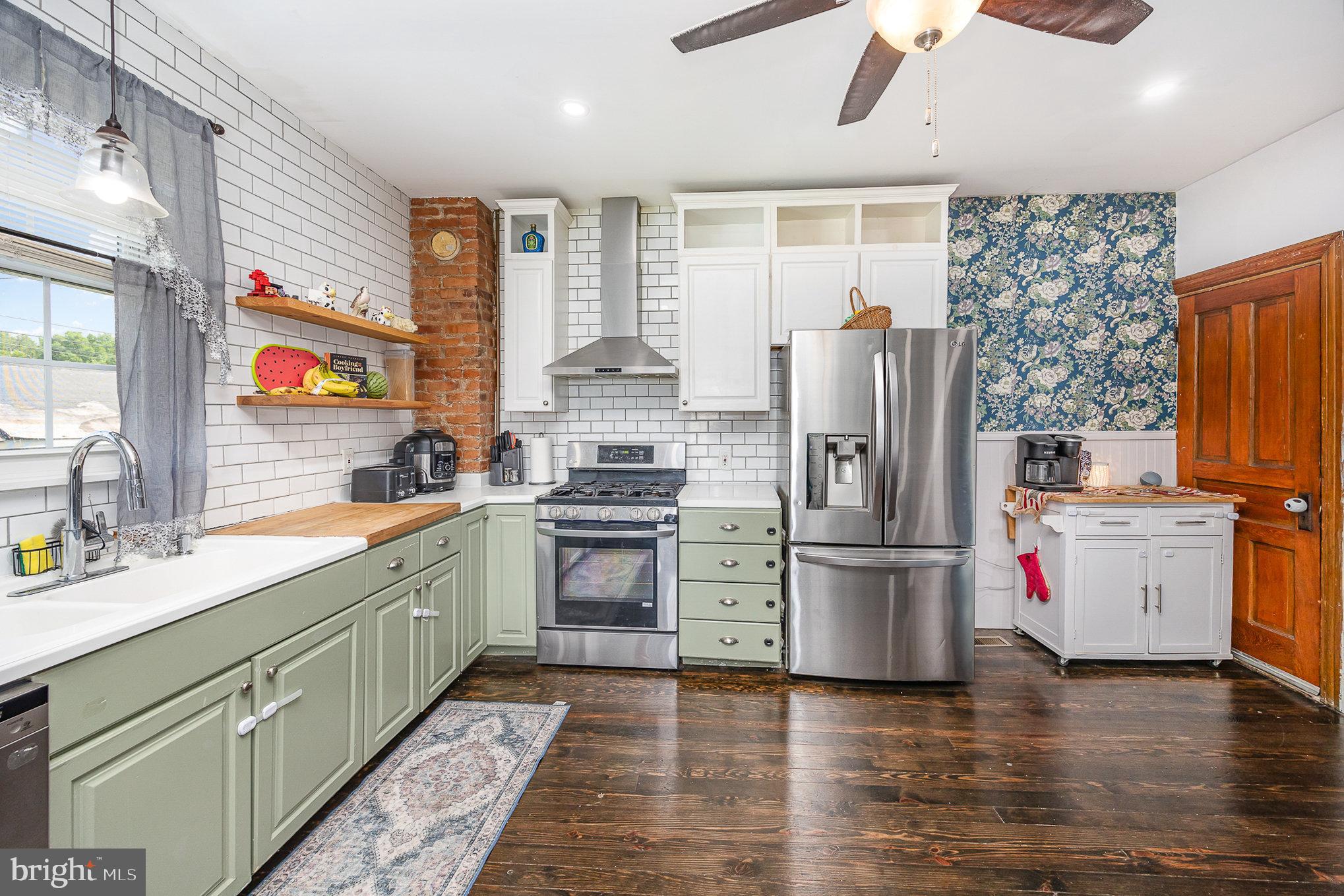 2527 South 3rd Street Steelton, PA 17113 - Photo 14 of 31 a kitchen with a refrigerator and a stove