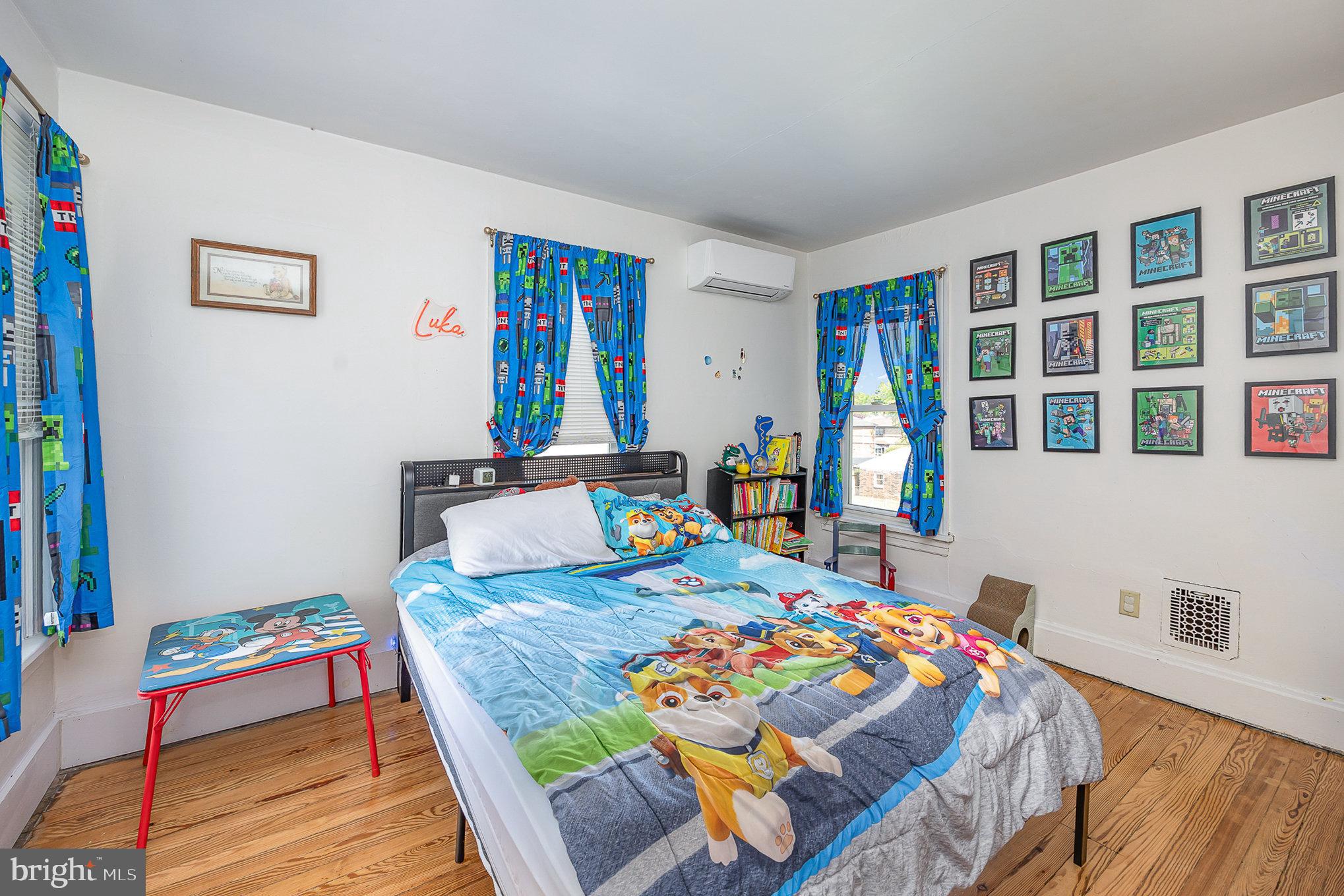 2527 South 3rd Street Steelton, PA 17113 - Photo 21 of 31 a bedroom with a bed and a table in it