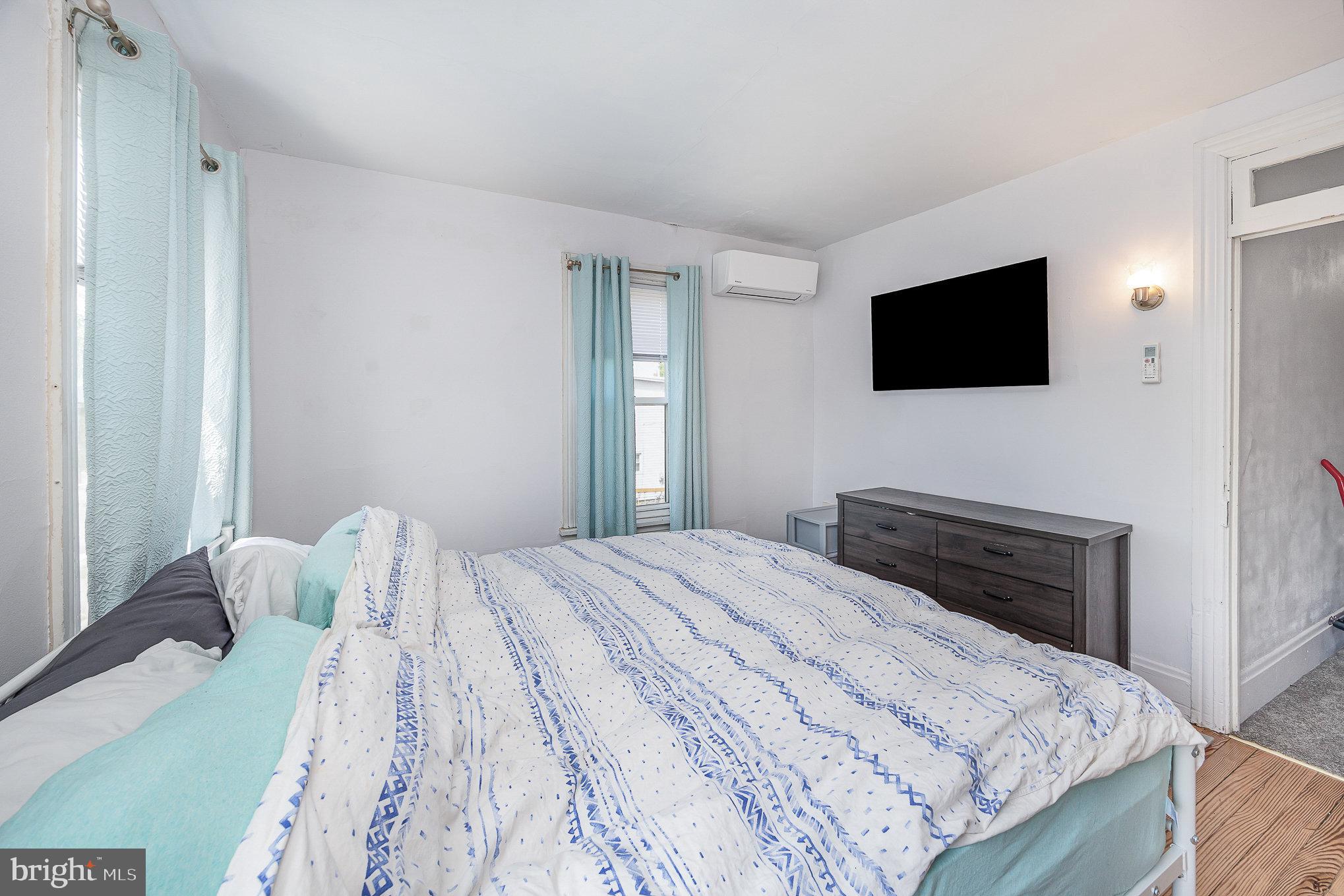 2527 South 3rd Street Steelton, PA 17113 - Photo 22 of 31 a bedroom with a bed and a flat screen tv