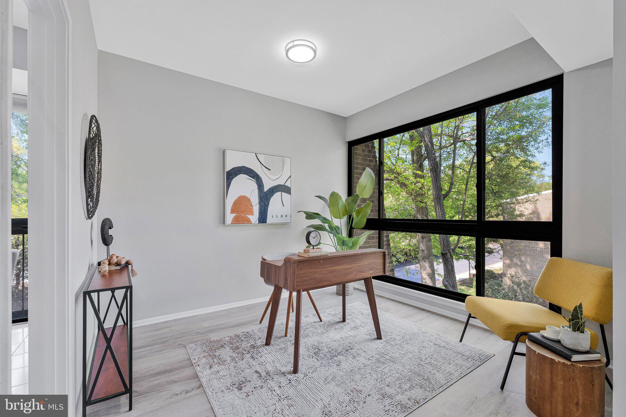 11616 Ivystone Court, Unit 5/300A Reston, VA 20191 - Photo 7 of 25 a living room with furniture and a large window