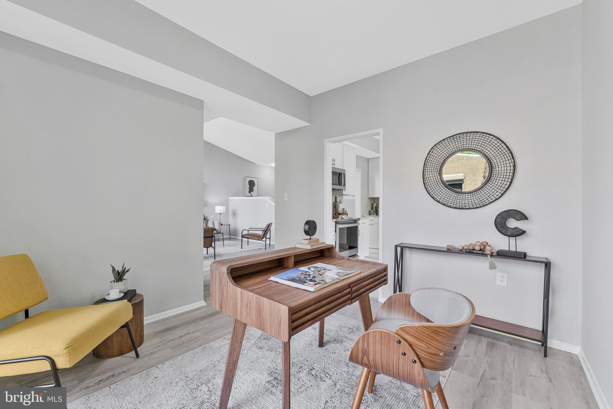 11616 Ivystone Court, Unit 5/300A Reston, VA 20191 - Photo 8 of 25 a living room with furniture a rug and a wall painting