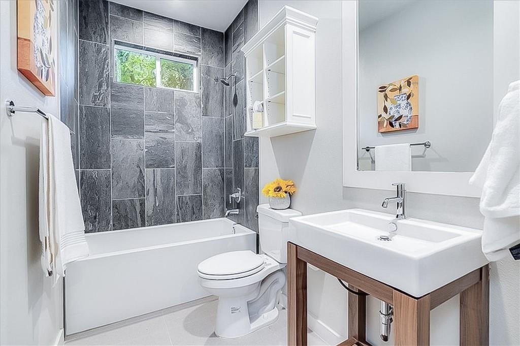 3913 Valley View Road, Unit B Austin, TX 78704 - Photo 12 of 24 a bathroom with a sink a toilet and shower