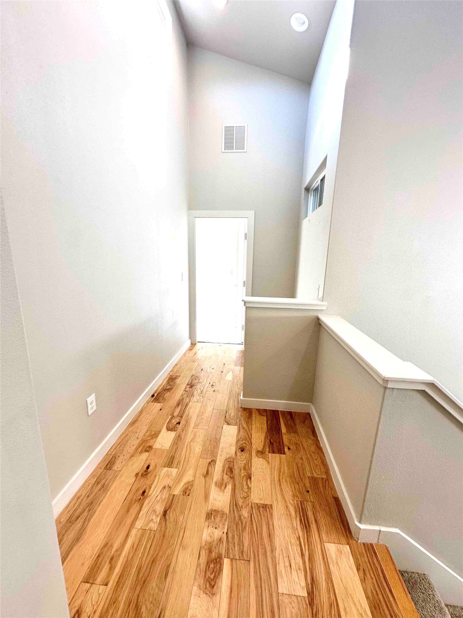 3913 Valley View Road, Unit B Austin, TX 78704 - Photo 13 of 24 a view of a hallway with wooden floor and staircase