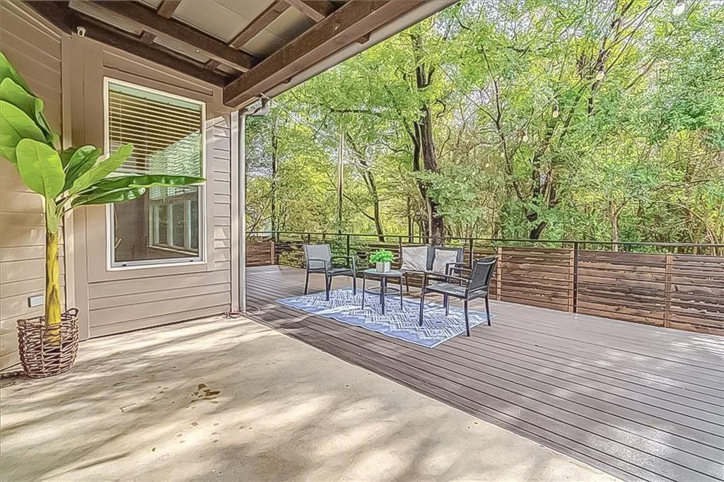 3913 Valley View Road, Unit B Austin, TX 78704 - Photo 20 of 24 a view of a patio with table and chairs and wooden floor