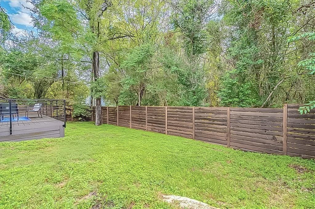 3913 Valley View Road, Unit B Austin, TX 78704 - Photo 23 of 24 a view of a backyard with a wooden fence