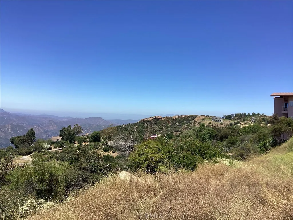 24725 West Saddle Peak Road Topanga, CA 90290 - Photo 3 of 13 a view of a lake with a city