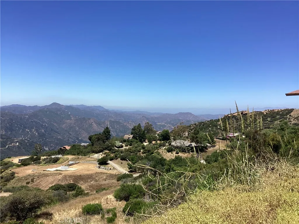 24725 West Saddle Peak Road Topanga, CA 90290 - Photo 5 of 13 a view of a houses with a yard