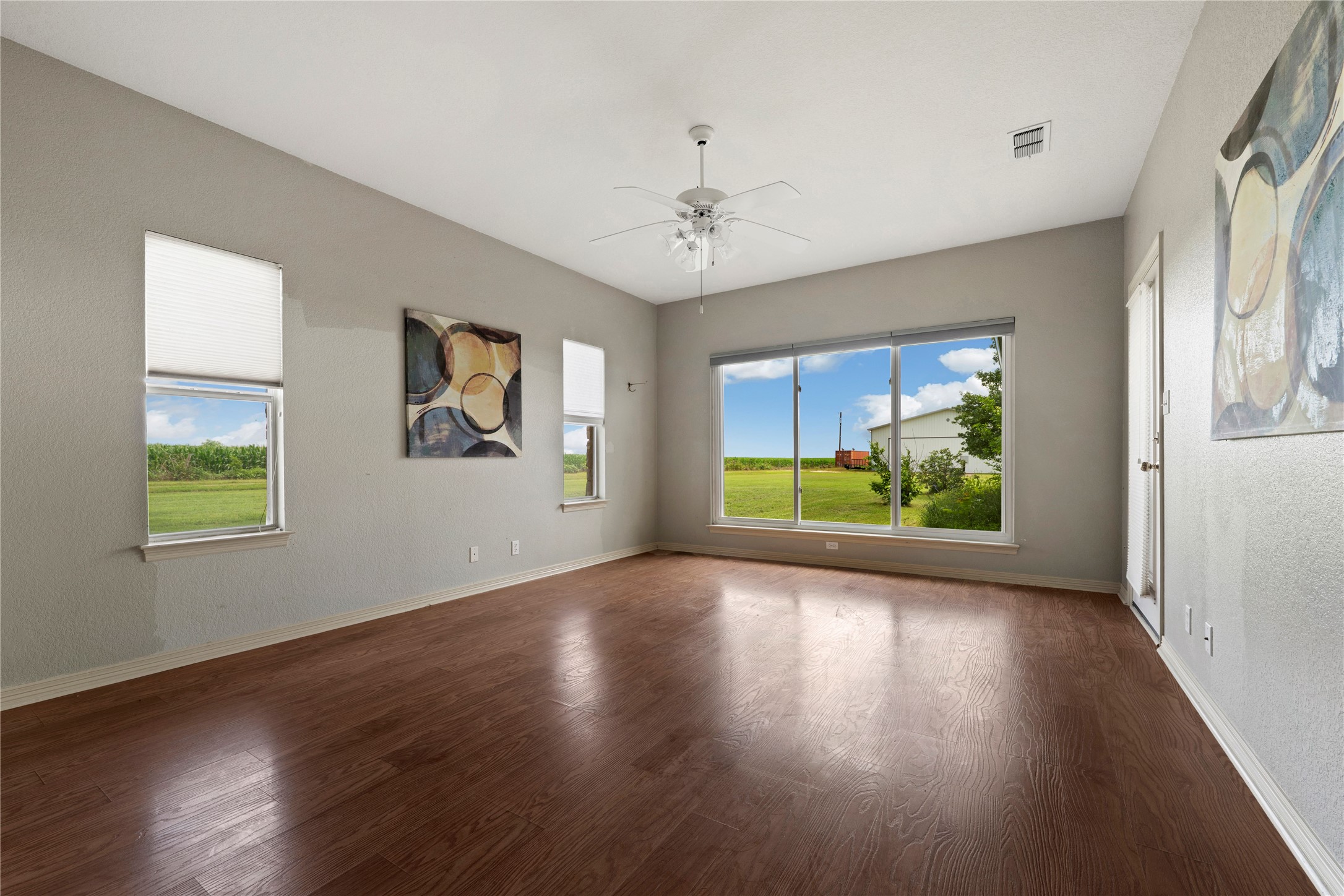 1005 East Buttercup Road Taylor, TX 76574 - Photo 14 of 38 a view of a room with window wooden floor and front door