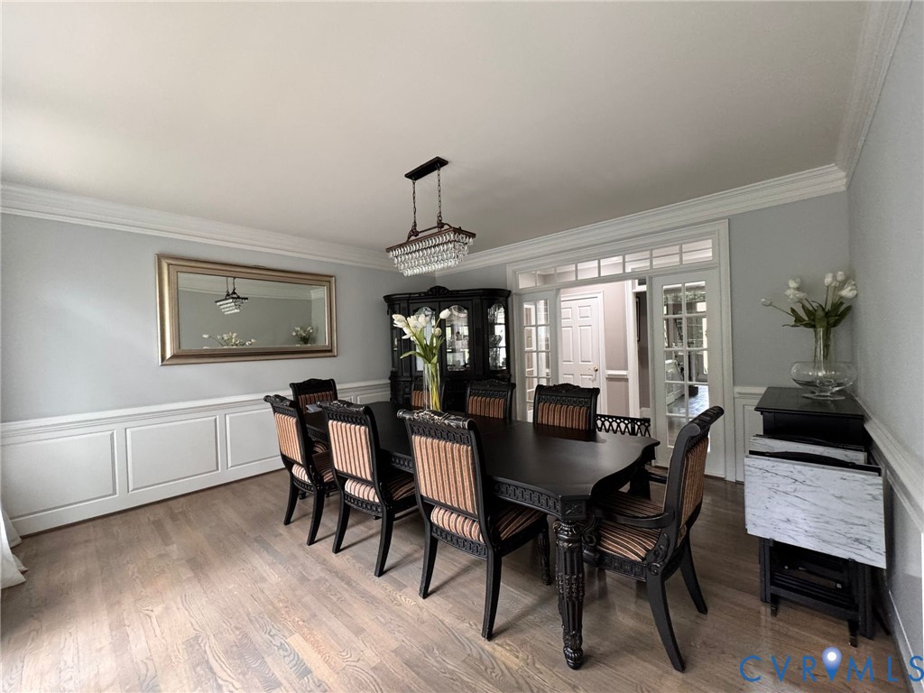 3231 Queens Grant Drive Midlothian, VA 23113 - Photo 12 of 48 a view of a dining room with furniture and wooden floor