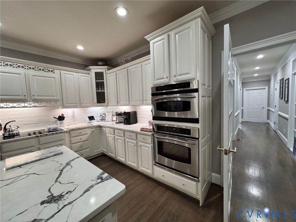 3231 Queens Grant Drive Midlothian, VA 23113 - Photo 15 of 48 a kitchen with granite countertop white cabinets and appliances