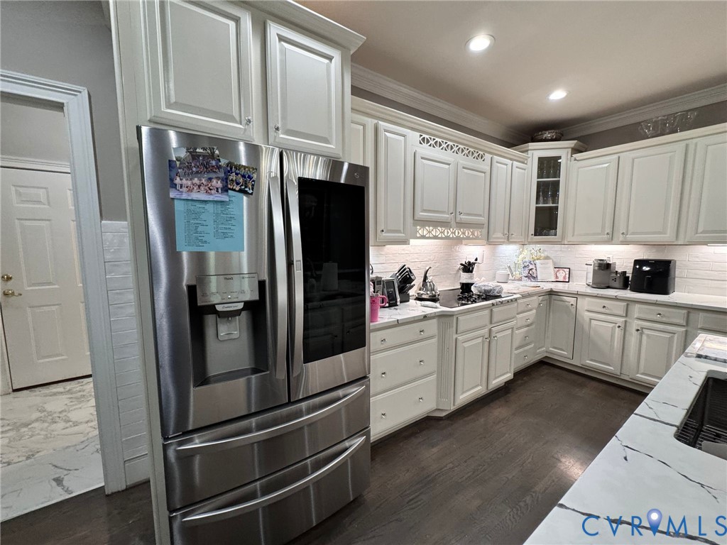 3231 Queens Grant Drive Midlothian, VA 23113 - Photo 16 of 48 a kitchen with stainless steel appliances a refrigerator sink and cabinets
