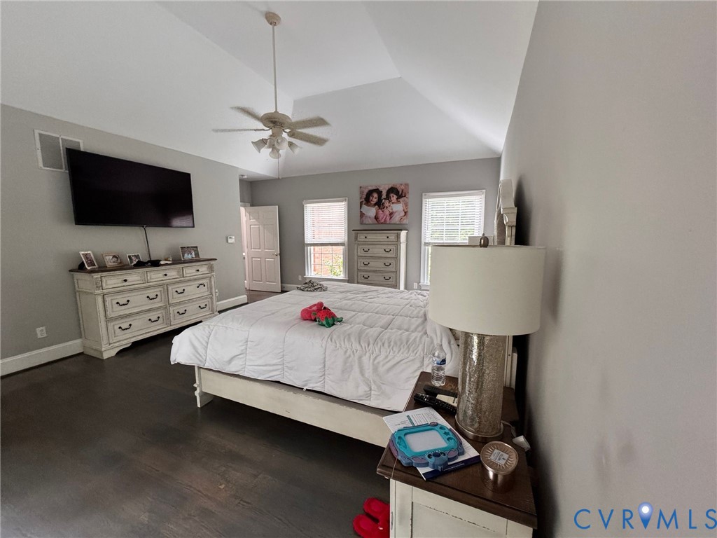 3231 Queens Grant Drive Midlothian, VA 23113 - Photo 21 of 48 a bedroom with a bed a dresser and a flat screen tv