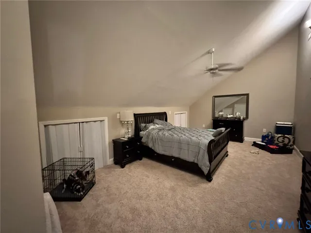 a bedroom with a bed and a couch