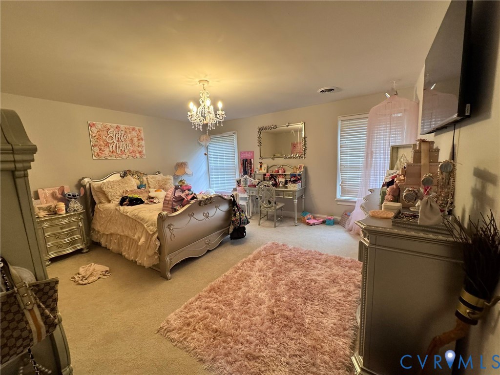 3231 Queens Grant Drive Midlothian, VA 23113 - Photo 25 of 48 a spacious bedroom with bed and a tv