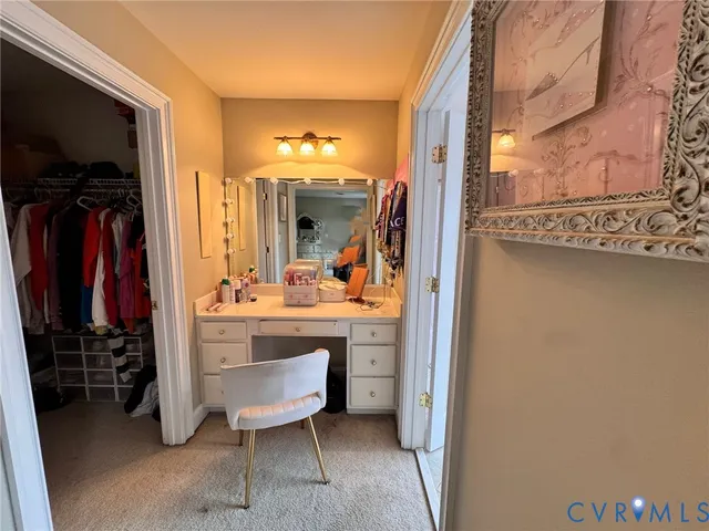 a view of bathroom with a sink and a mirror
