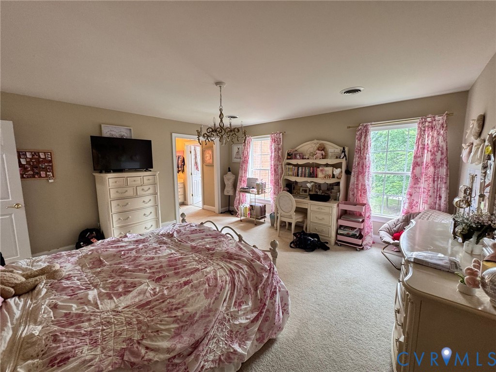 3231 Queens Grant Drive Midlothian, VA 23113 - Photo 30 of 48 a bed room with a bed a television and dresser