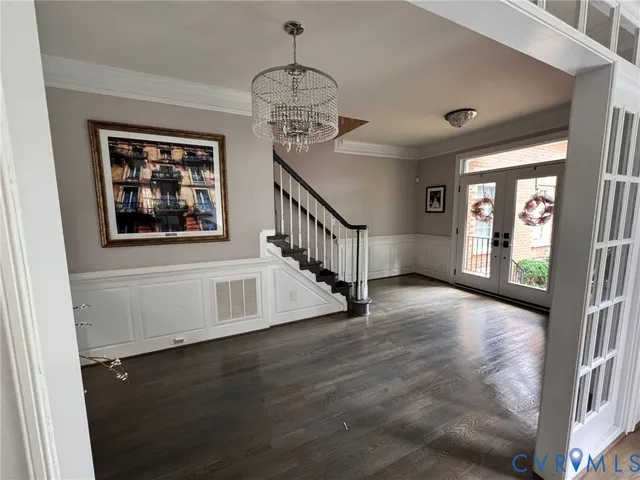 a view of an entryway with wooden floor